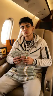 Take the uploaded photo of the person and generate a photorealistic 9х16 image of this person (please make sure to keep facial similarity) in one of the following randomly selected settings:   Leaning against a bright Lamborghini or Rolls-Royce, wearing a tactical vest or puffer jacket, showing off a luxury watch or chain.  Inside a private jet with stacks of cash on their lap, dressed in designer streetwear (like BAPE, Louis Vuitton, or Nike Tech).   Posing in front of a private jet at night, holding fanned-out stacks of hundred-dollar bills, with a confident or nonchalant expression.   Sitting in a luxury car with a starlight ceiling, wearing iced-out chains and sunglasses, mid-conversation or staring coolly ahead.   Standing against an urban graffiti backdrop, throwing up hand gestures while wearing a designer scarf or hoodie, heavy jewelry, and rings.   The final image should have a high-contrast, bold, Instagram-worthy aesthetic. Use realistic lighting and textures. Make sure the background, outfit, and pose reflect confidence, wealth, and a street-smart vibe. Rotate between settings randomly each time this is run.